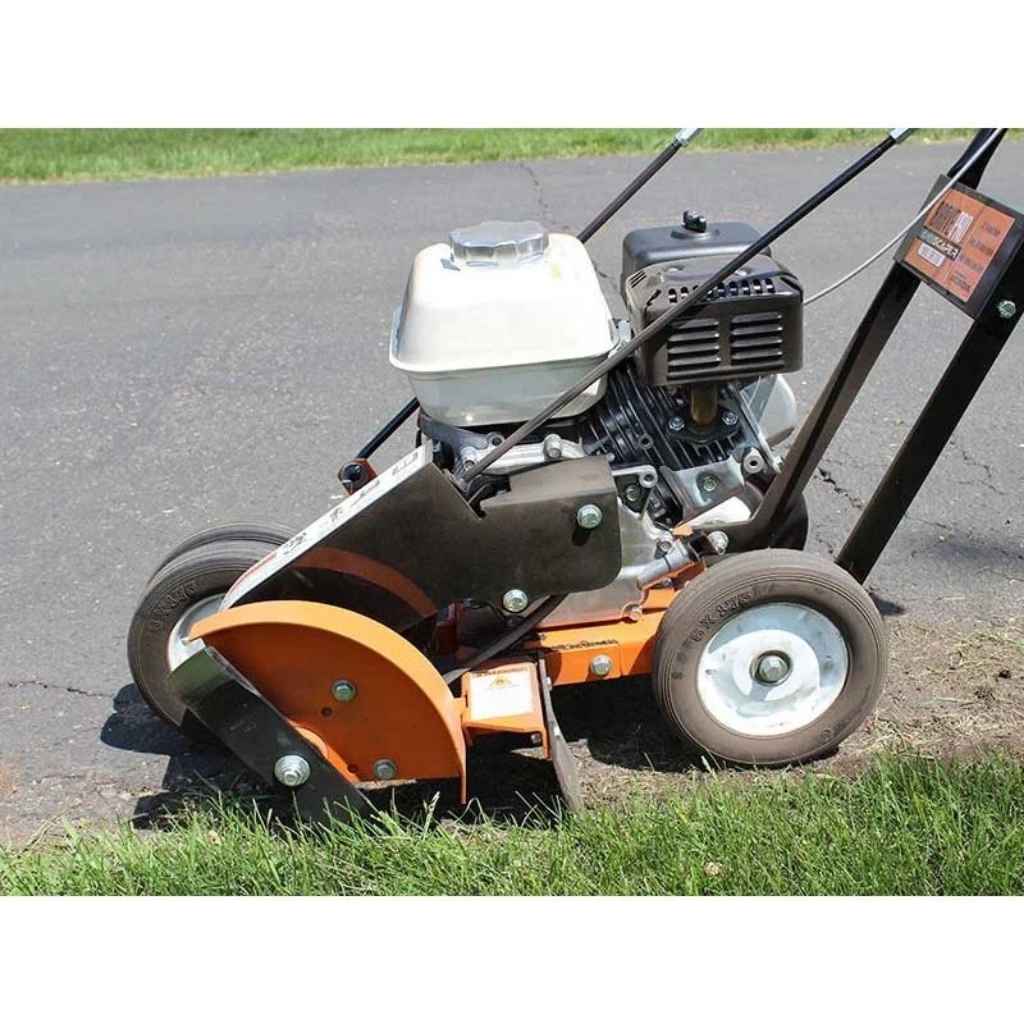 Bravepro 10 inch lawn edger on a driveway with grass in the foreground