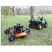 Small ATV pulling a bravepro finish cut pull behind 60 inch mower through a grassy area with trees in the background.