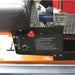 Close-up of a brave finish cut 60 inch tow behind mower with starting procedures label