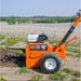 Orange BravePro 18 inch trencher in a field with a clear sky