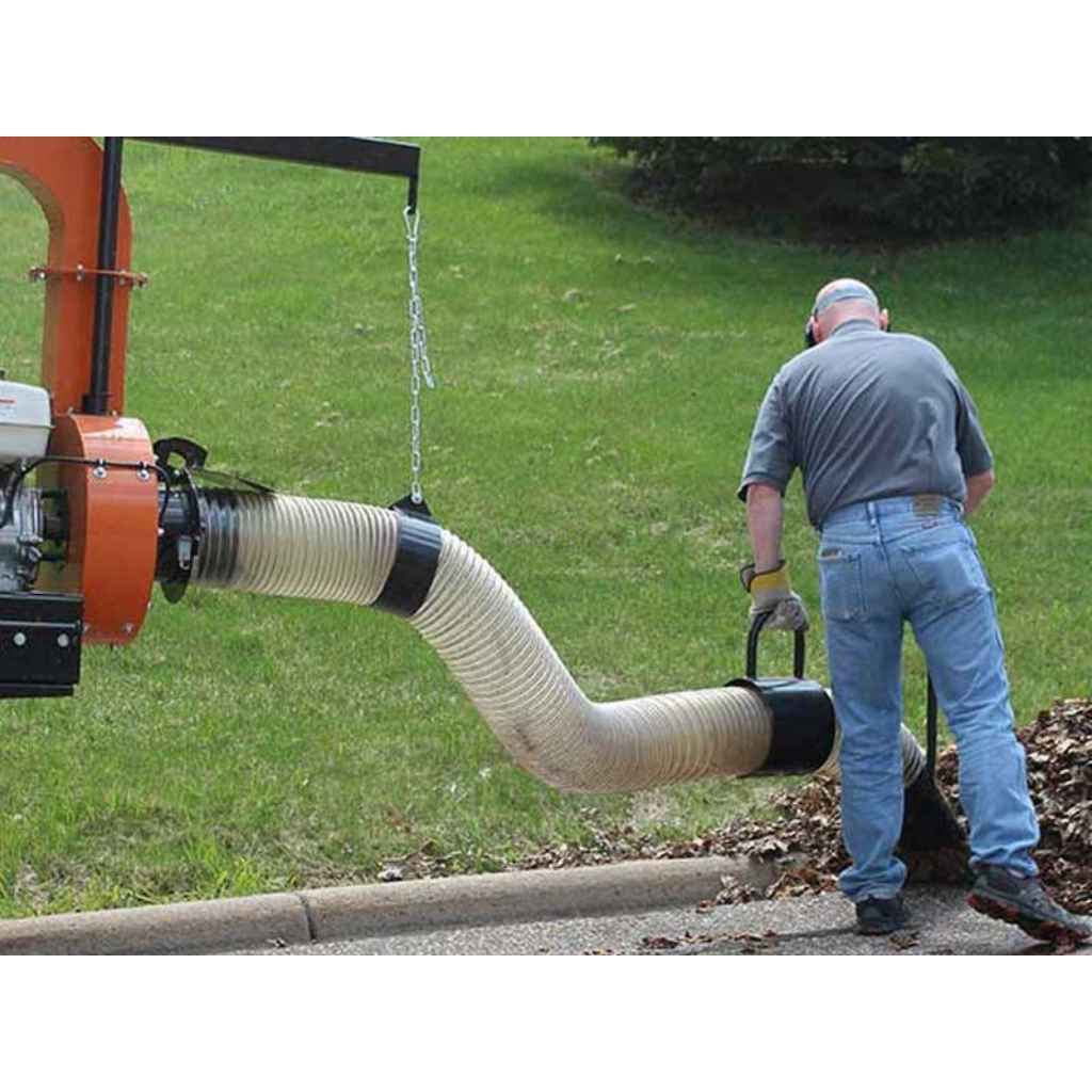 Person using a bravepro chipper shredder vacuum truck loader briggs & stratton 18 hp engine 10in model brptl160b with a long hose in a grassy area.