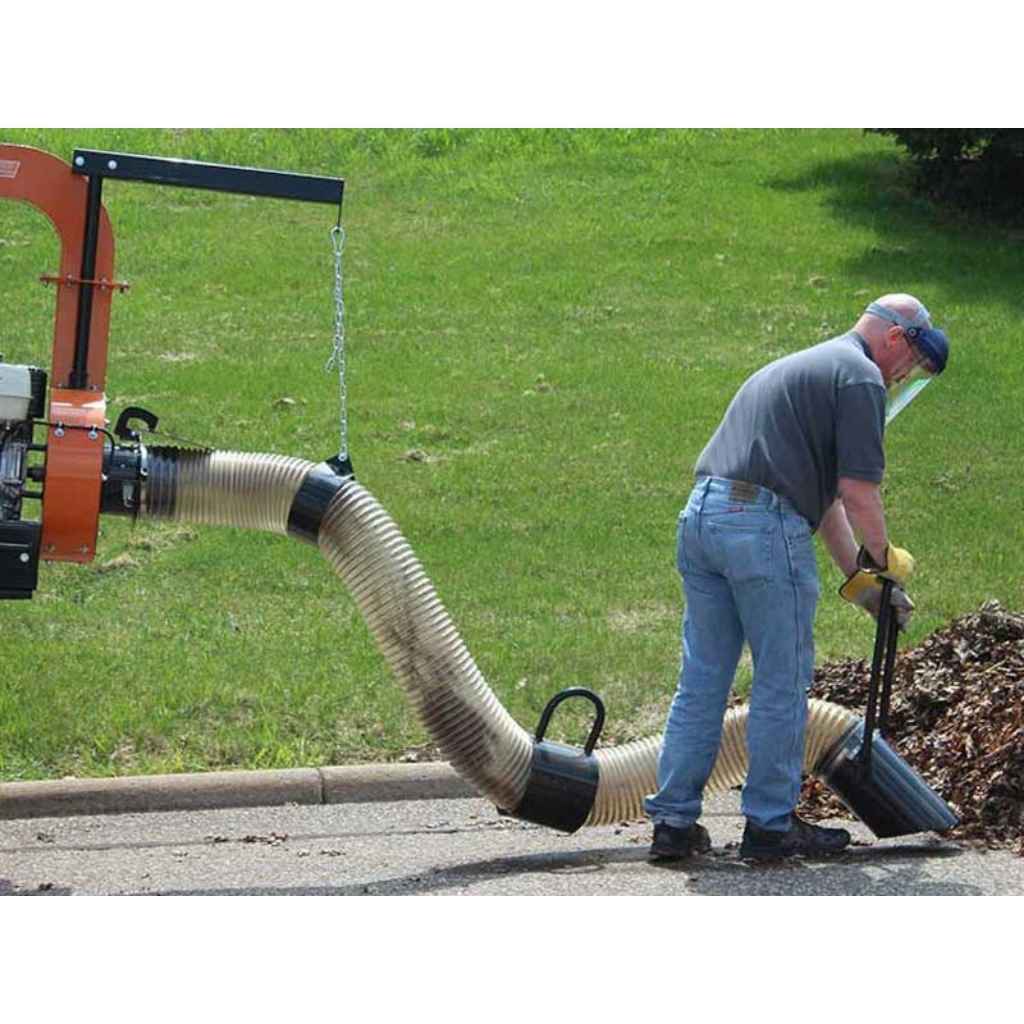Person using a bRAVE PRO BRPTL160B TRUCK LOADER with a hose to clear leaves from a driveway.