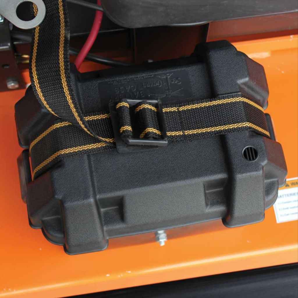Black battery pack with a strap on a brave pro 60 inch finish cut tow behind mower