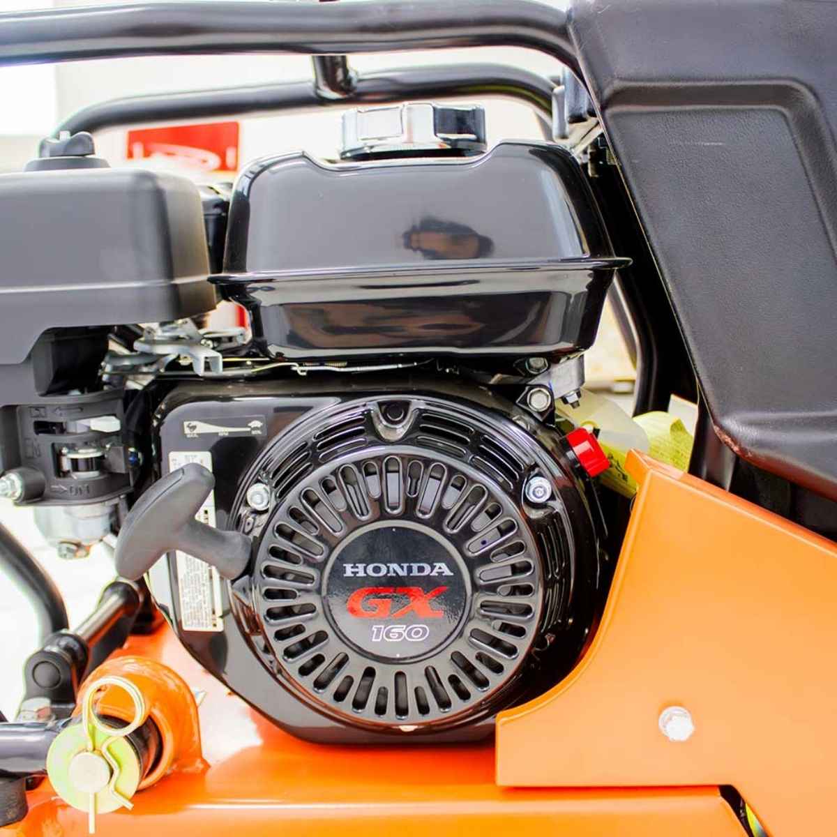 Close-up of a Brave plate compactor BRPFP135H with a Honda GX engine on a piece of machinery.