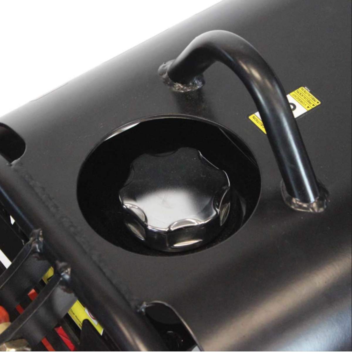 Close-up of a black oil cap on a Brave 15 inch reversible plate compactor engine cover with a white background.