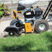 Brave Star Blade edger on grass with wooden fence in the background