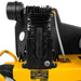 Close-up of a yellow and black Dewalt 8 gal 1.9 hp wheelbarrow air compressor with visible branding.