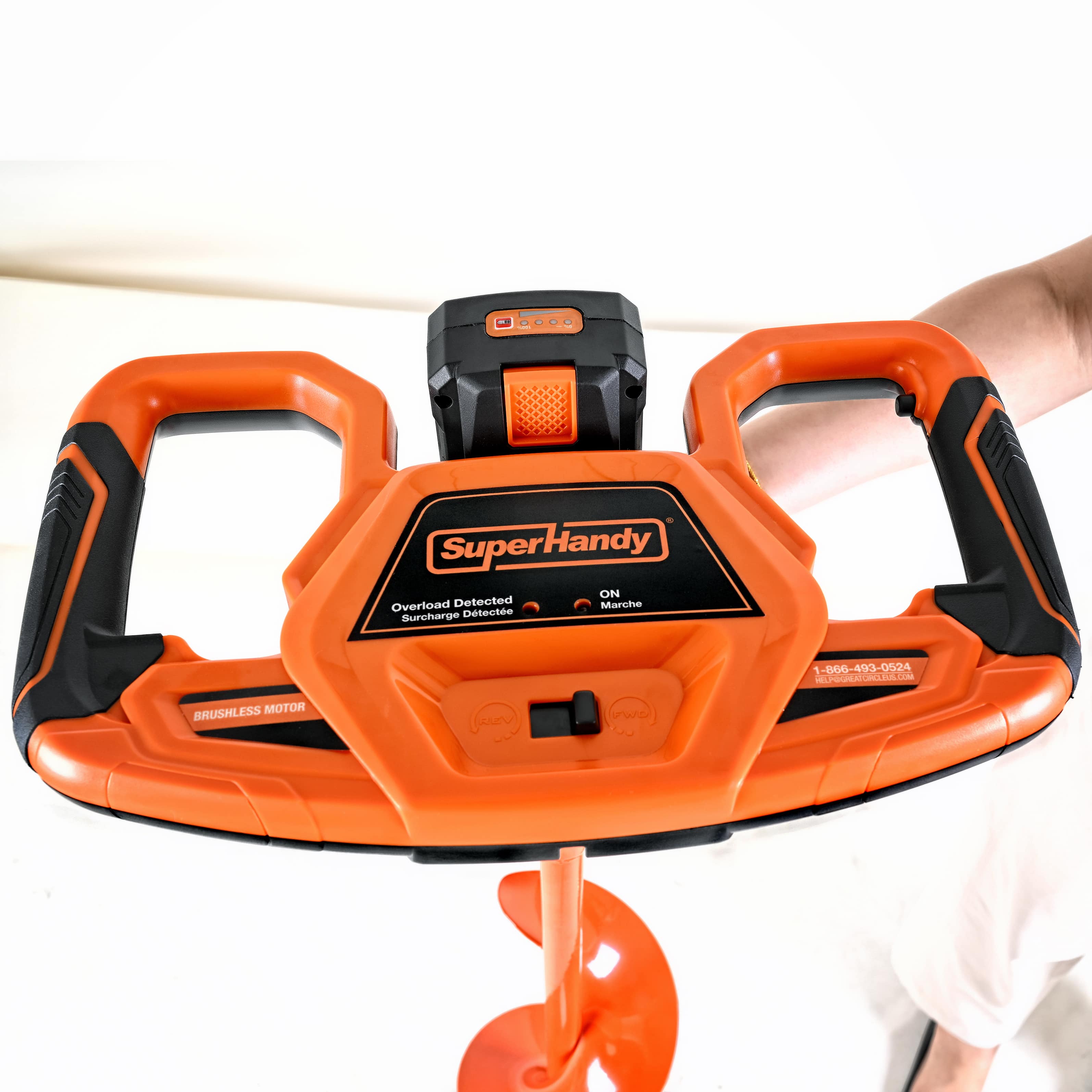Orange and black Electric drill ice auger held by a person on a white background with superhandy logo