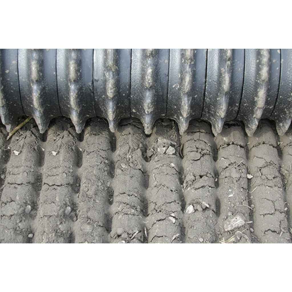 Close-up of a GreyWolf till n claw Cultipacker with a textured surface.