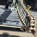 a close up of the chain for a minitrencher georipper sitting in the bed of a truck