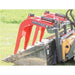 Red Greywolf quick attach grapple skid steer attachment on a green grass background