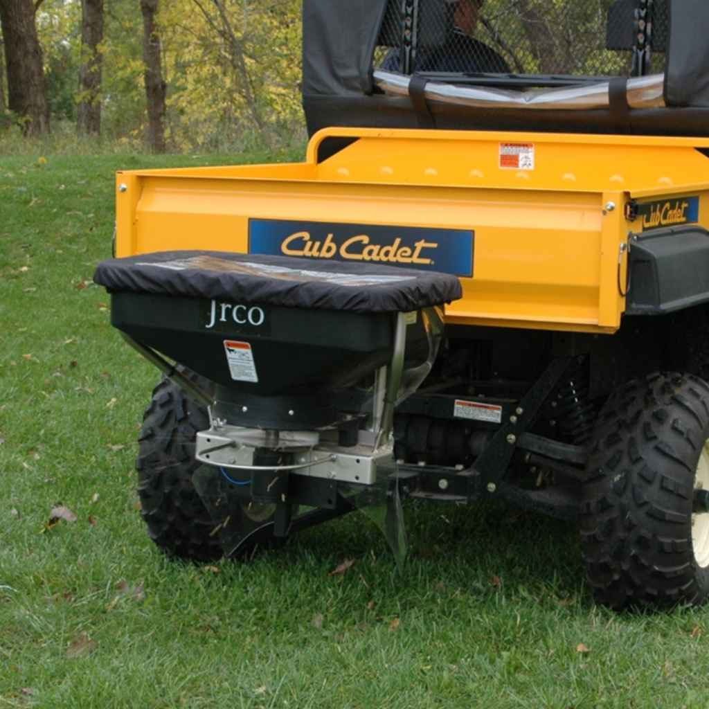 Jrco hitch mount 504u spreader attached to a vehicle on grass