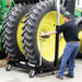Person using a k & M manufacturing wheel dolly on a large tractor tire