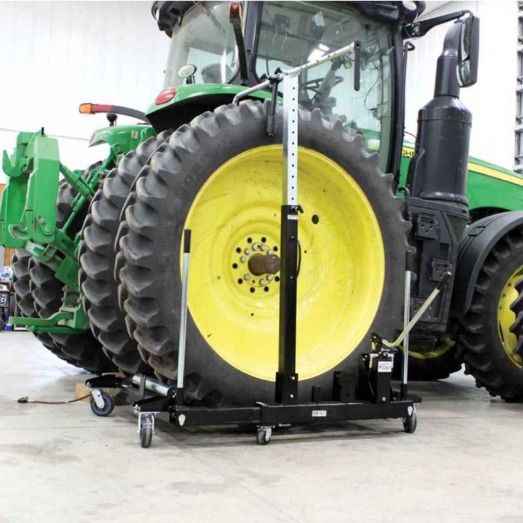 Tractor tire on a k and m 3800 lb wheel dolly in a workshop setting
