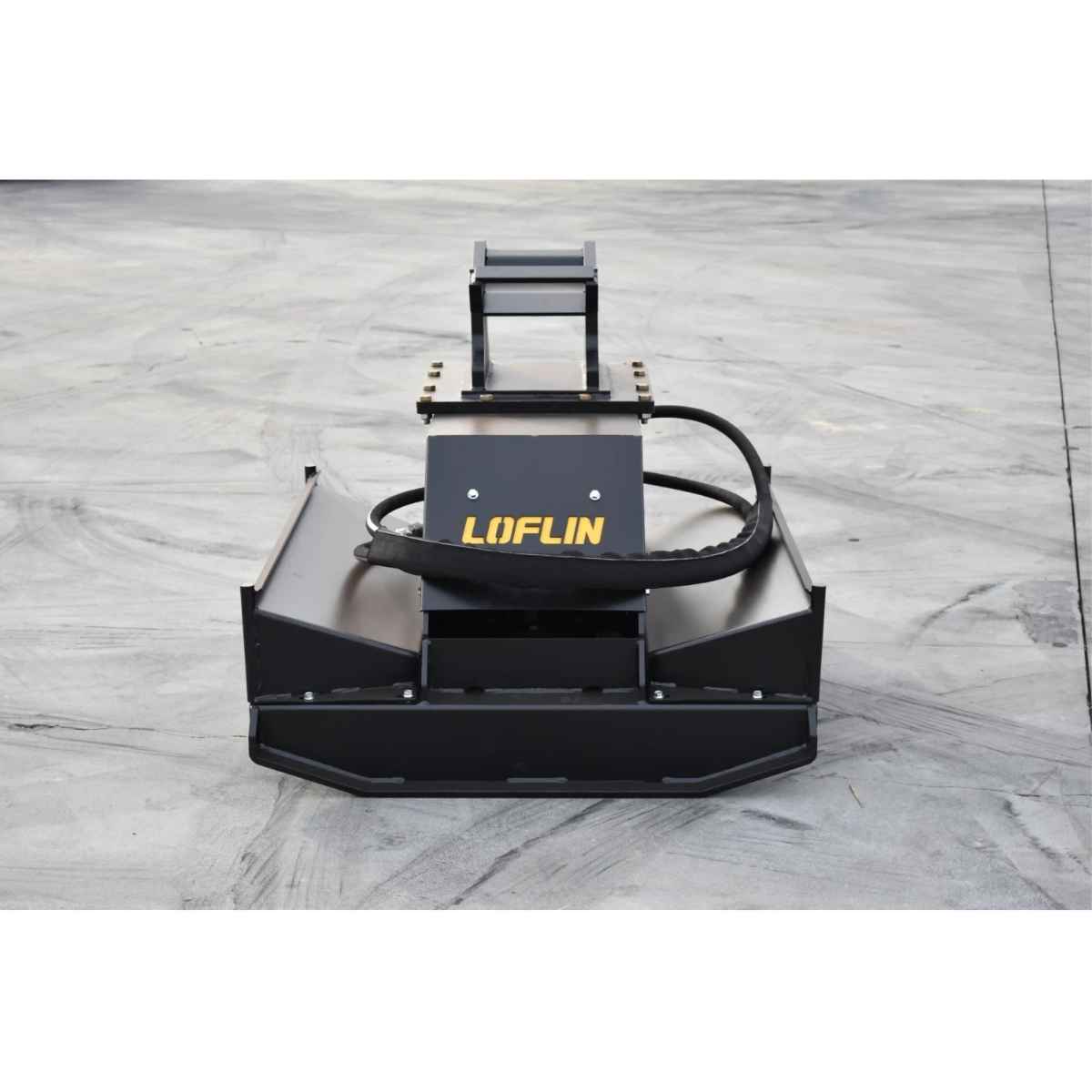 A black Loflin Brush cutter attachment for mini excavator with a prominent yellow LOFLIN logo, photographed from a top-down angle on a gray concrete floor.