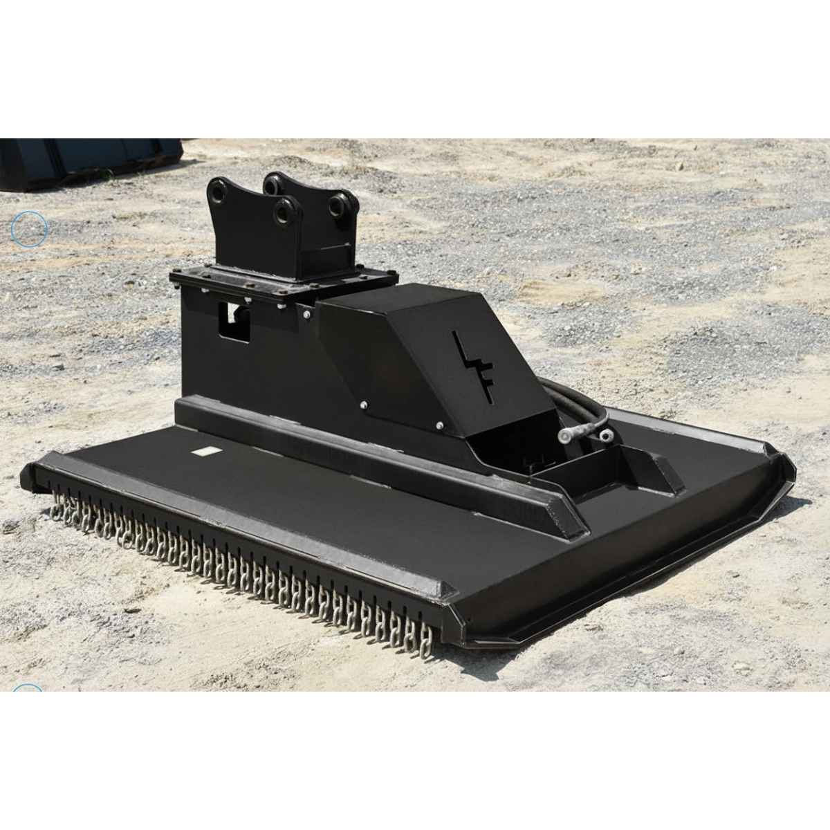 Black Loflin Mini Excavator Brush Cutter on a light brown ground