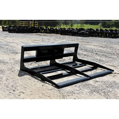 Black Loflin Mini Skid Steer Land Plane on a gravel surface with rows of similar pallets in the background.