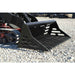 Black Loflin mini skid steer rock bucket on a gravel surface