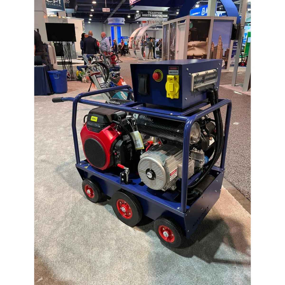 Portable industrial Makinex 32kw 480v generator on wheels at a trade show