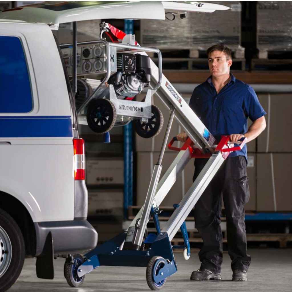 Person using a makinex hand truck to load a generator into the back of a van