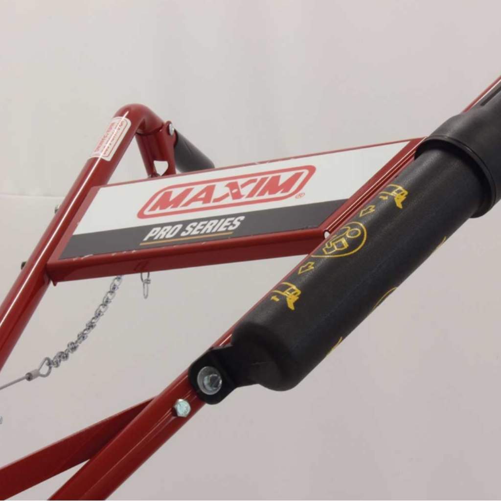Red Maxim 26 Inch Tiller with a  Pro Series lift stand with black shock absorber on a light gray background