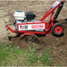 Red Maxim rm4h tiller machine in use on a field