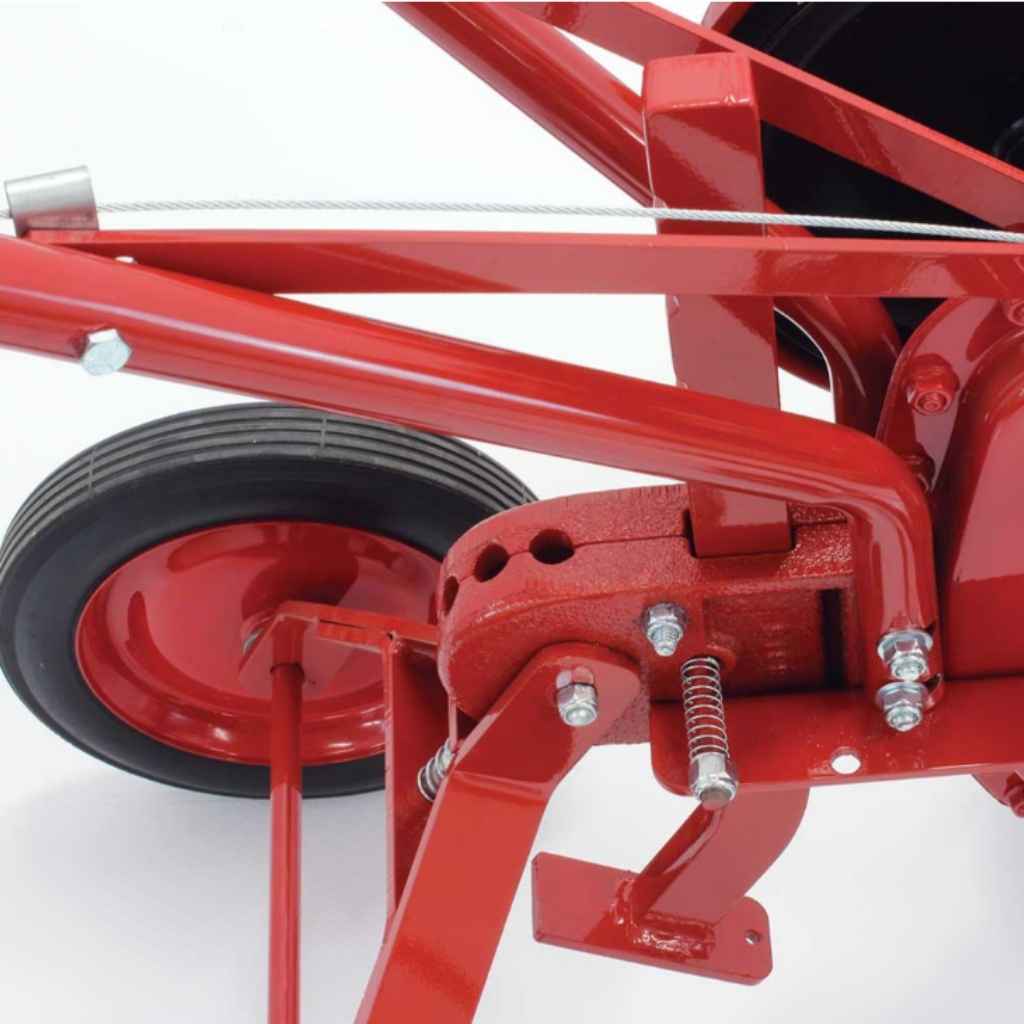 Close-up of a red mechanical component thats on a maxim RMT55H Commercial tiller on a white background