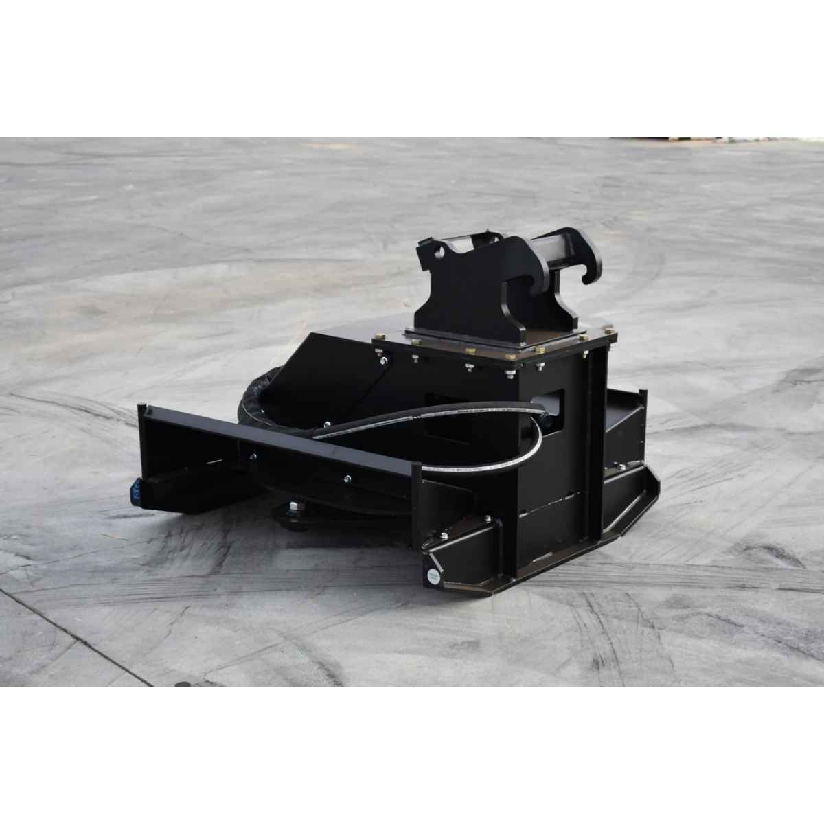 A heavy-duty black loflin fabrication brush cutter for mini excavator, photographed on a gray concrete surface.