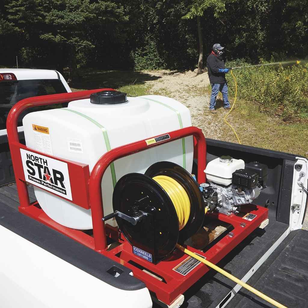 North Star 100 gallon capacity sprayer on a truck bed with a person using it outdoors.