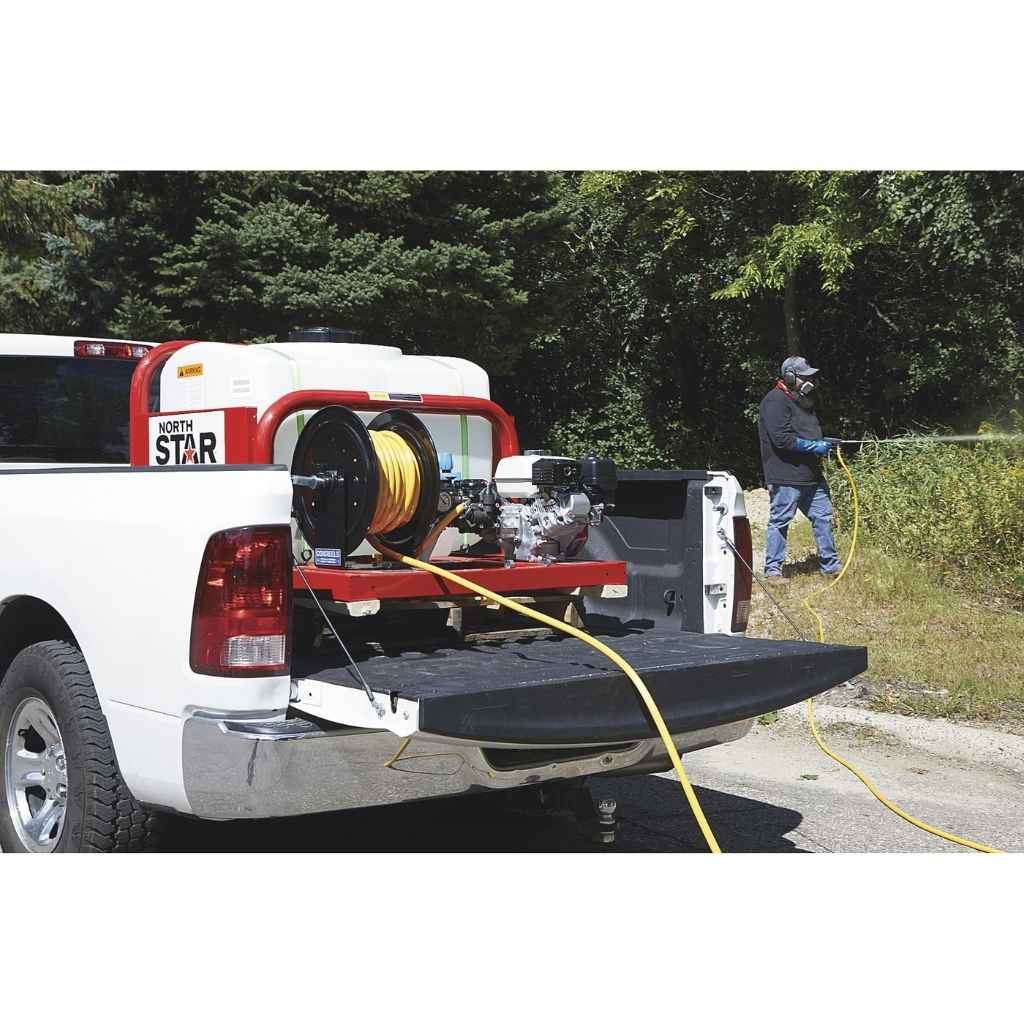 White truck with a North Star 100 gallon skid sprayer in the back, connected to a hose, with a person standing nearby.