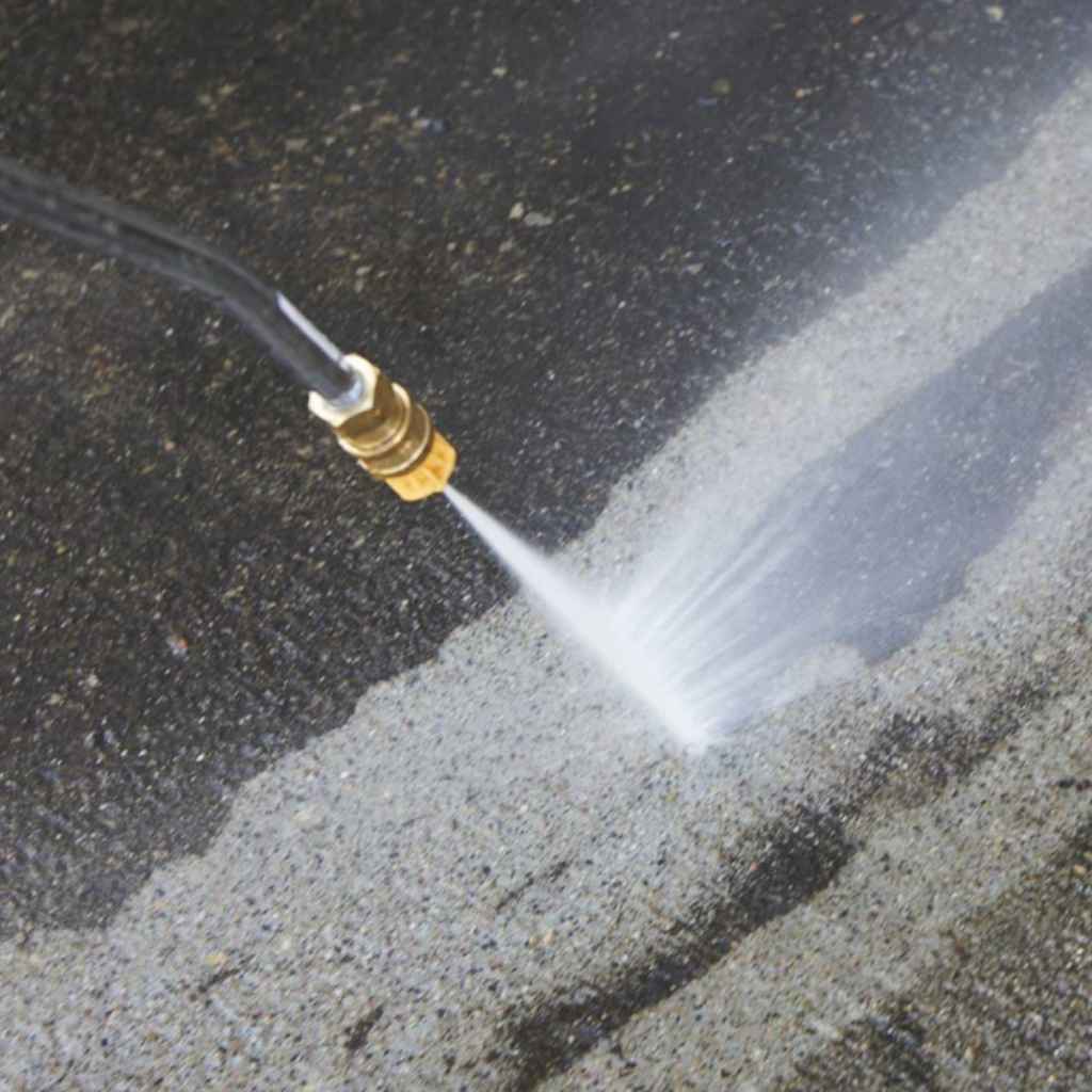 northstar 3000 psi 230v pressure washer cleaning a concrete surface