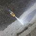 northstar 3000 psi 230v pressure washer cleaning a concrete surface