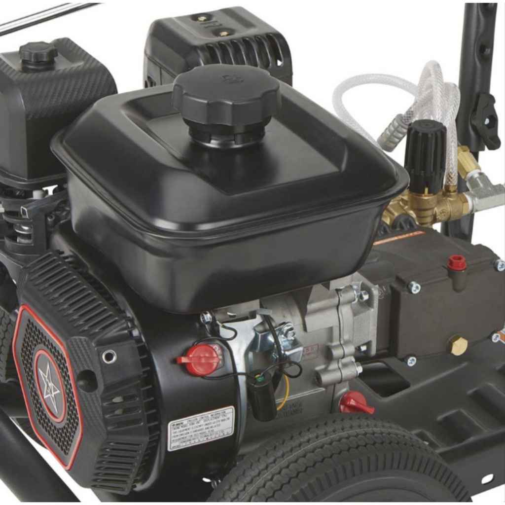 Close-up of a black engine to a northstar gas 3100 psi pressure washer with visible branding on a white background