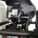 Close-up of a mechanical component on a northstar 4000 psi hot water pressure washer, likely a burner or engine part.