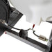 Close-up of a northstar 4000 psi terailer mounted hot water pressure washer mechanical component with a white container and metal parts on a white background