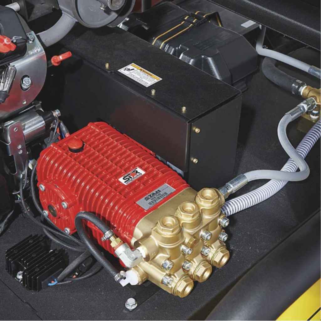 Red and black northstar 4000 psi hot water pressure washer pump with visible branding on a dark surface