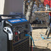 powerhorse 10500w inverter generator with 'Power horse' branding outdoors, connected to a tool.