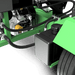 Close-up of a green and black yardbeast lz 705 log splitter with mechanical components on a black background