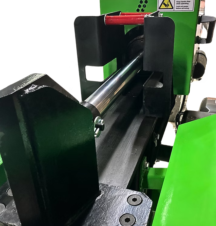 Close-up of a Yardbeast 25 ton log splitter wedge with green and black colors