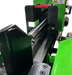 Close-up of a Yardbeast 25 ton log splitter wedge with green and black colors