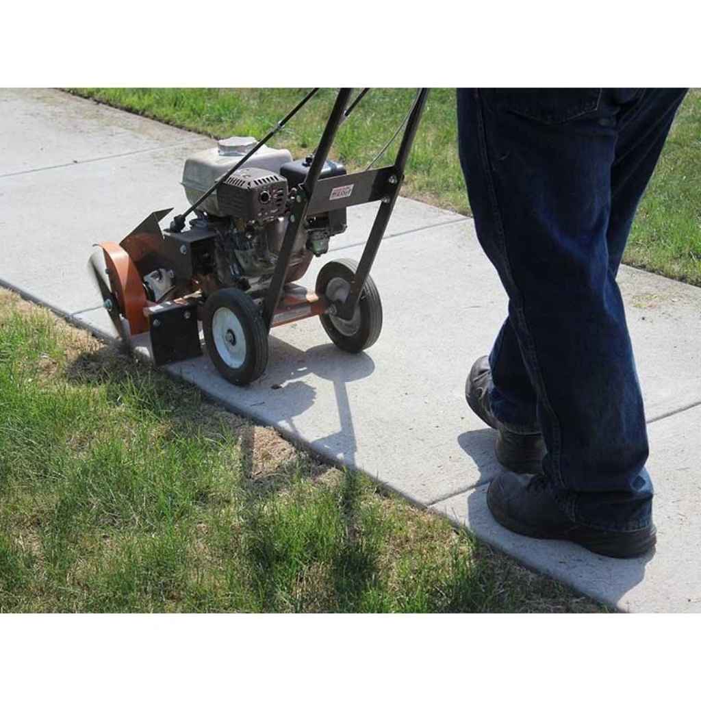 Person using a Bravepro 10 in lawn edger on a sidewalk