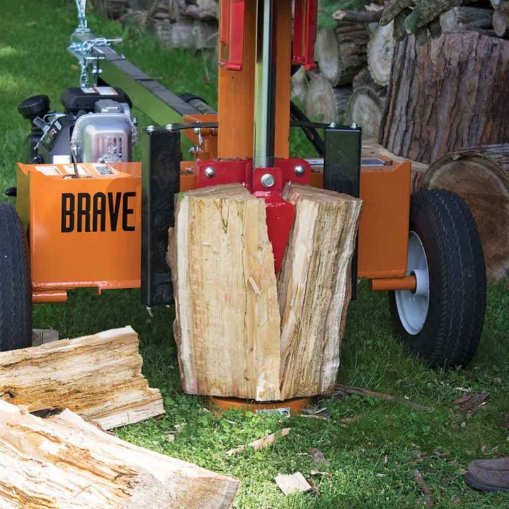 brave towable log splitter 24 ton labeled 'Brave' with a log on a grassy background