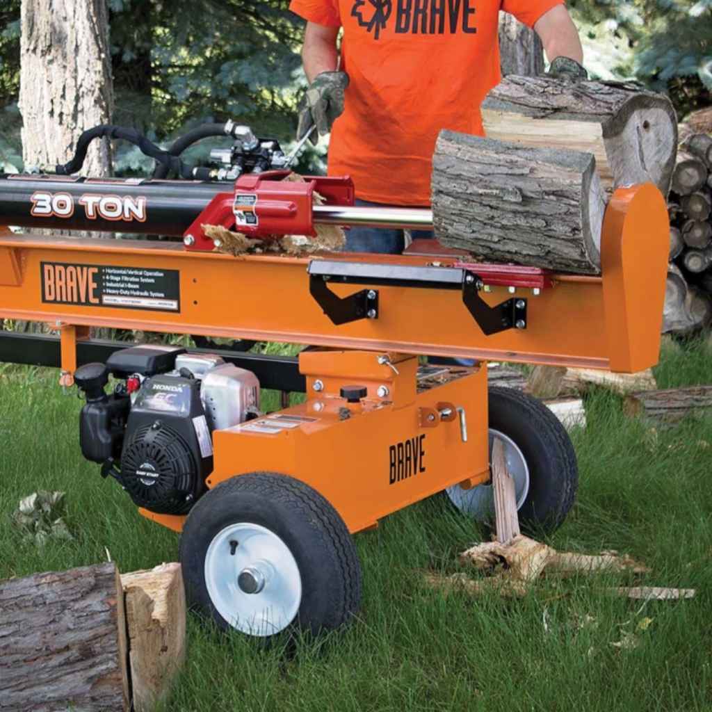 Orange brave log splitter 30 ton with a person in an orange shirt in a forest setting