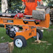 Orange brave log splitter 30 ton with a person in an orange shirt in a forest setting