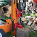 bravepro 30 ton towable log splitter in use with chopped wood around