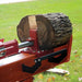 Red and orange brave pro 37 ton log splitter with a log on a grassy background