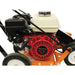 Close-up of a brave 10 inch lawn edger with a Honda GX engine on a lawn mower with a white background