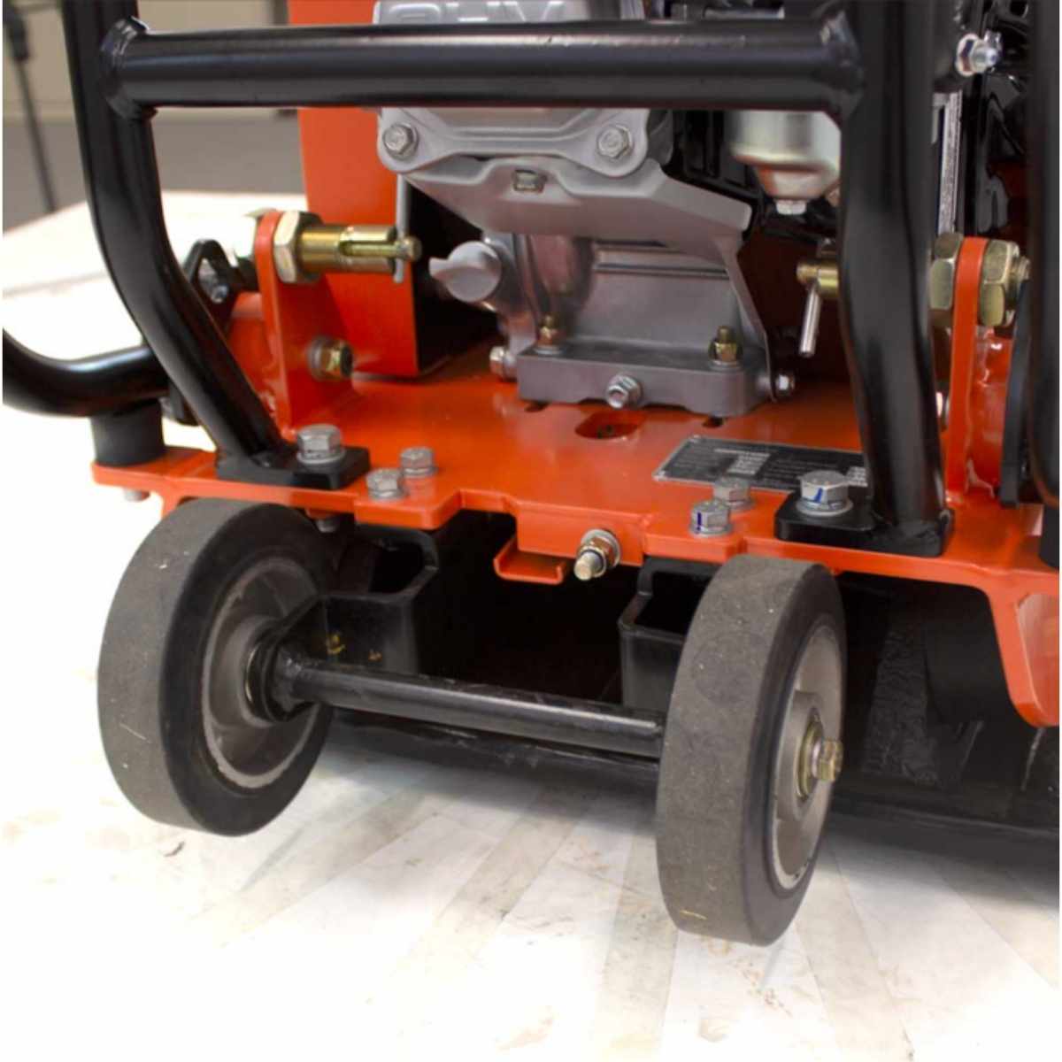 Close-up of a Brave plate compactor 20 inch BRPFP145H with wheels on a light background