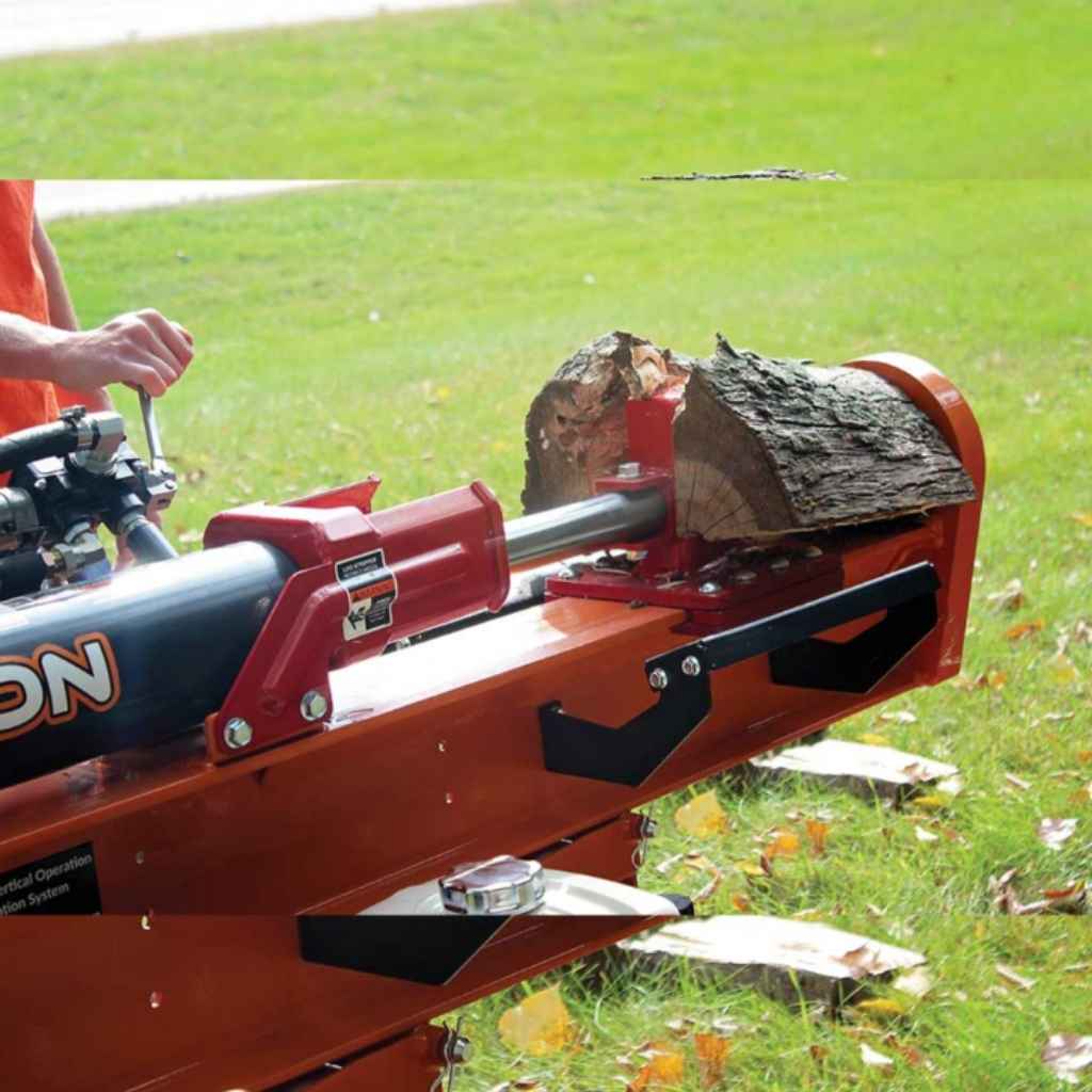 Person using a red and orange bravepro 37 ton log splitter on a grassy area