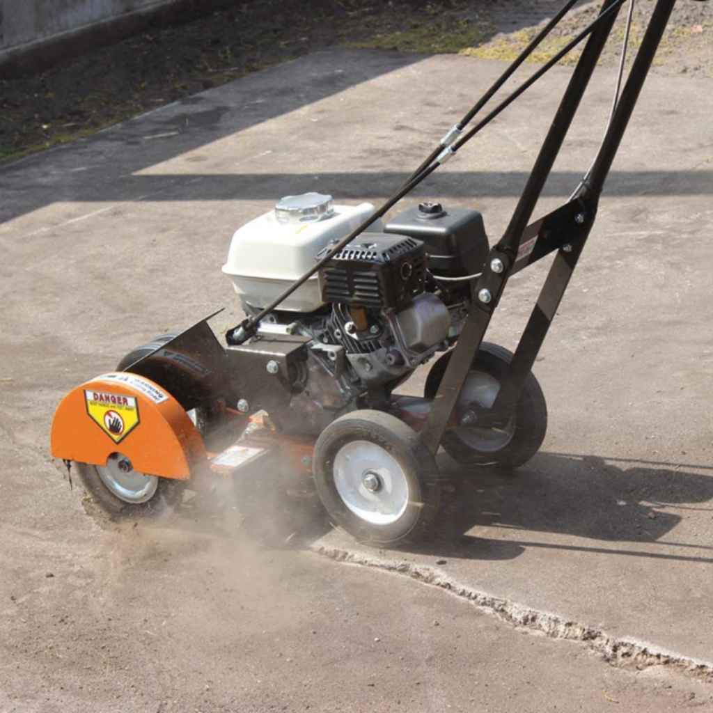 orange Brave Crack Cleaner being used on a concrete surface